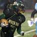 Huron's Parish Jacobs runs towards the outside for more yards as Ann Arbor Huron took on Ann Arbor Skyline Friday September 30, 2011 at Huron High School. Jeff Sainlar I AnnArbor.com 
