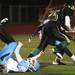 Huron's Jaavaid Love trucks a defender on way to his touchdown as Ann Arbor Huron took on Ann Arbor Skyline Friday September 30, 2011 at Huron High School. Skyline won the game 28-12. Jeff Sainlar I AnnArbor.com 
