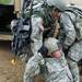 Specialist Brandon Smith (left), 23, of Chicago, helps to drag Specialist Jon Webb, 30, of St. Clair, into a truck during a training exercise on Sept. 24. The training exercise aimed to help soldiers practice how to handle casualties and other patrol scenarios at war. On Sept. 30, many members of the Viking Battalion mobilized as active duty soldiers for three months of training. A deployment to Afghanistan is expected to begin later this year. Jeff Sainlar | AnnArbor.com